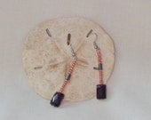 Faceted purple Czech bead dangling from 1 1/2 inch earrings