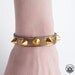 Shiny bronze leather spiked bracelet