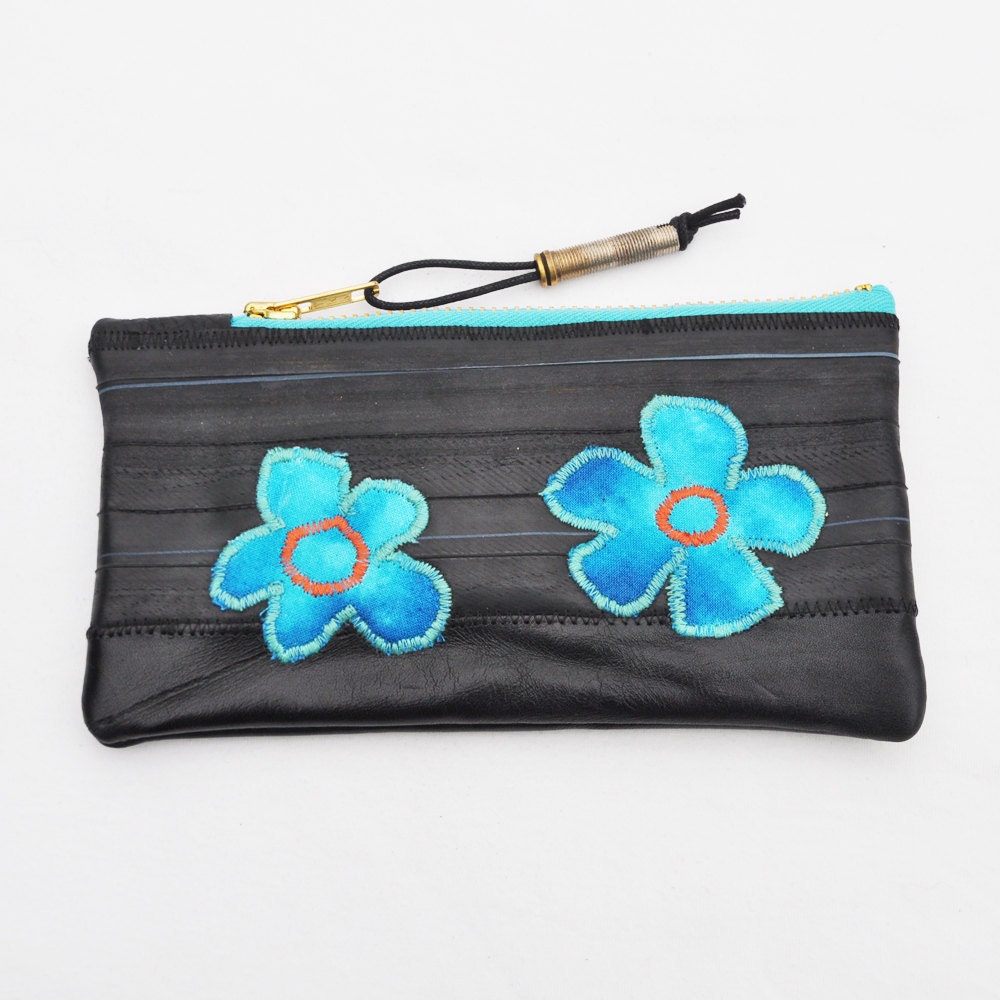 Pouch made from upcycled bike inner tubes and leather scraps