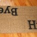 Hi. and Bye. doormat