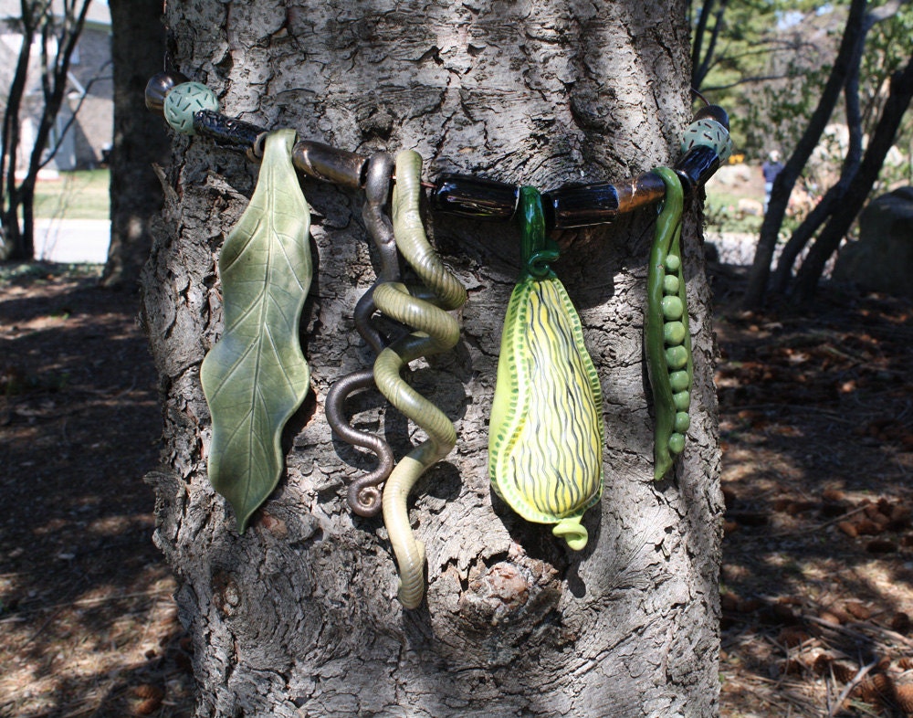 Tree Bling, pea-green, black & bronze jewellery for your trees, handmade exotic, organic, ceramic baubles to decorate your tree trunks