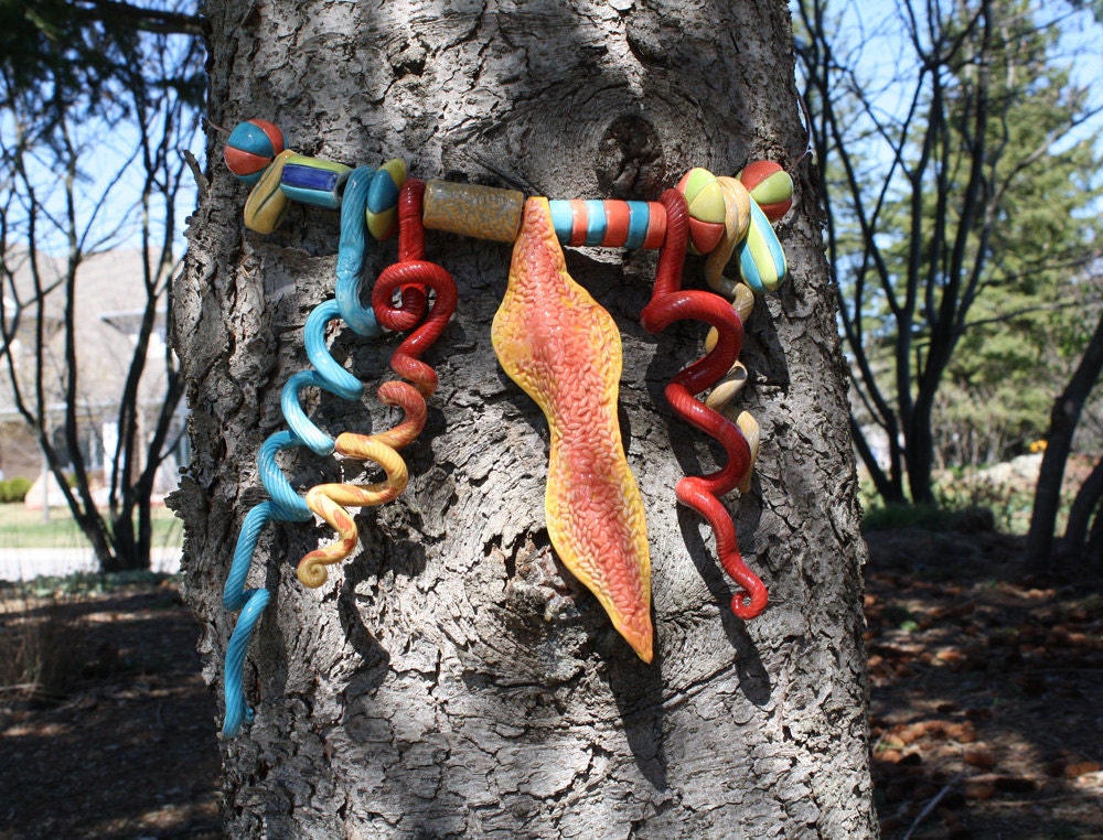 Tree Bling, brightly coloured jewellery for your trees, handmade exotic, organic, ceramic baubles to decorate your tree trunks