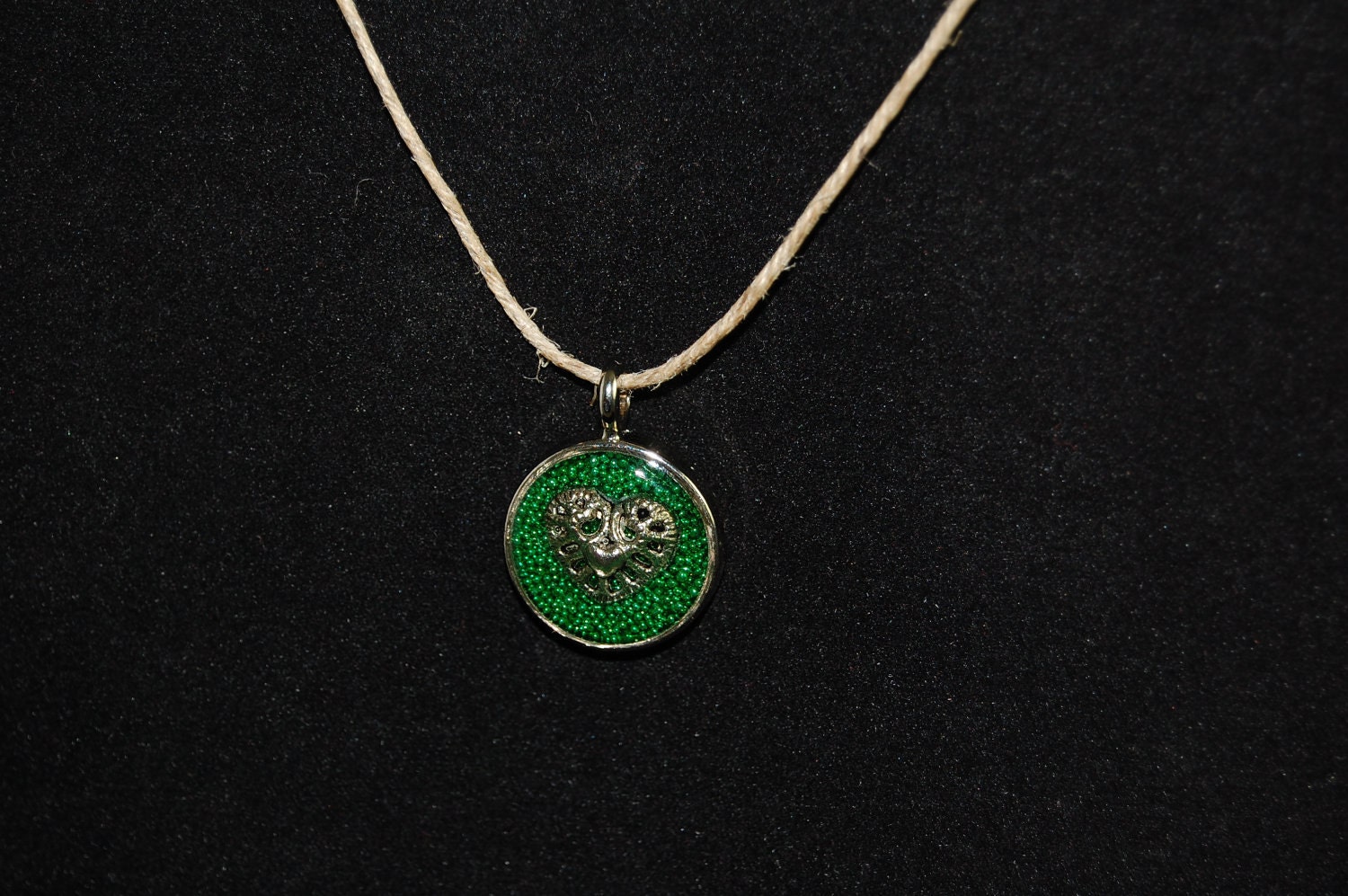 Heart on green background