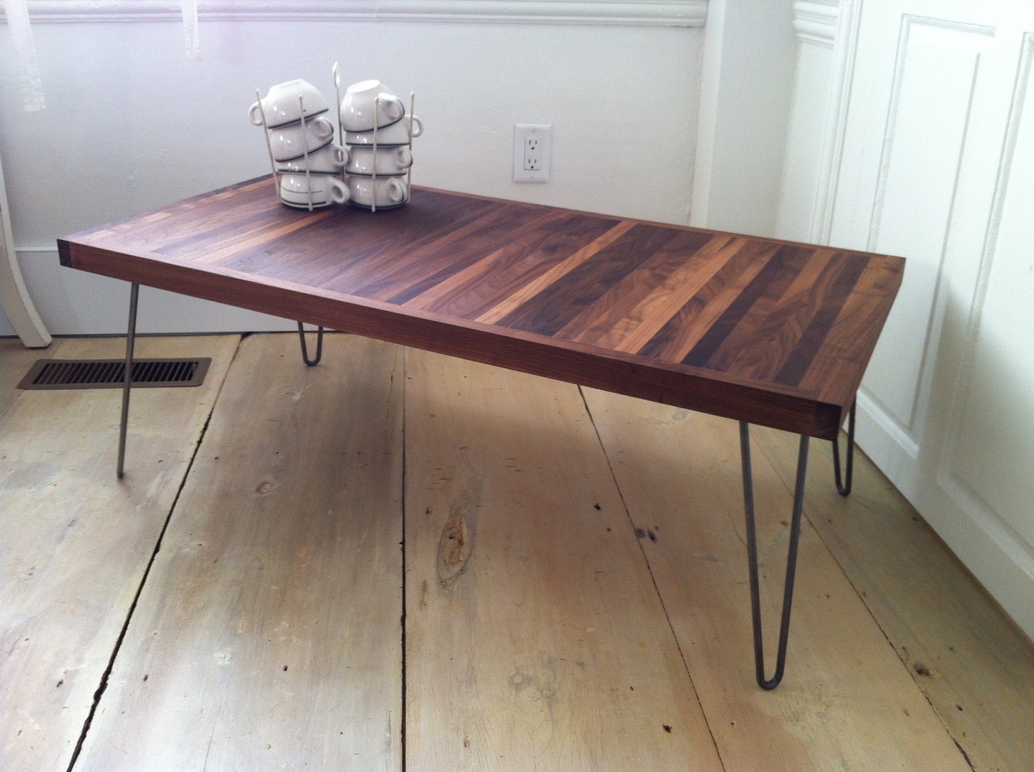 Mid century modern contemporary coffee table featuring solid walnut top and hairpin legs