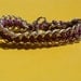Leather like cord and chain braided bracelet, silver and purple.