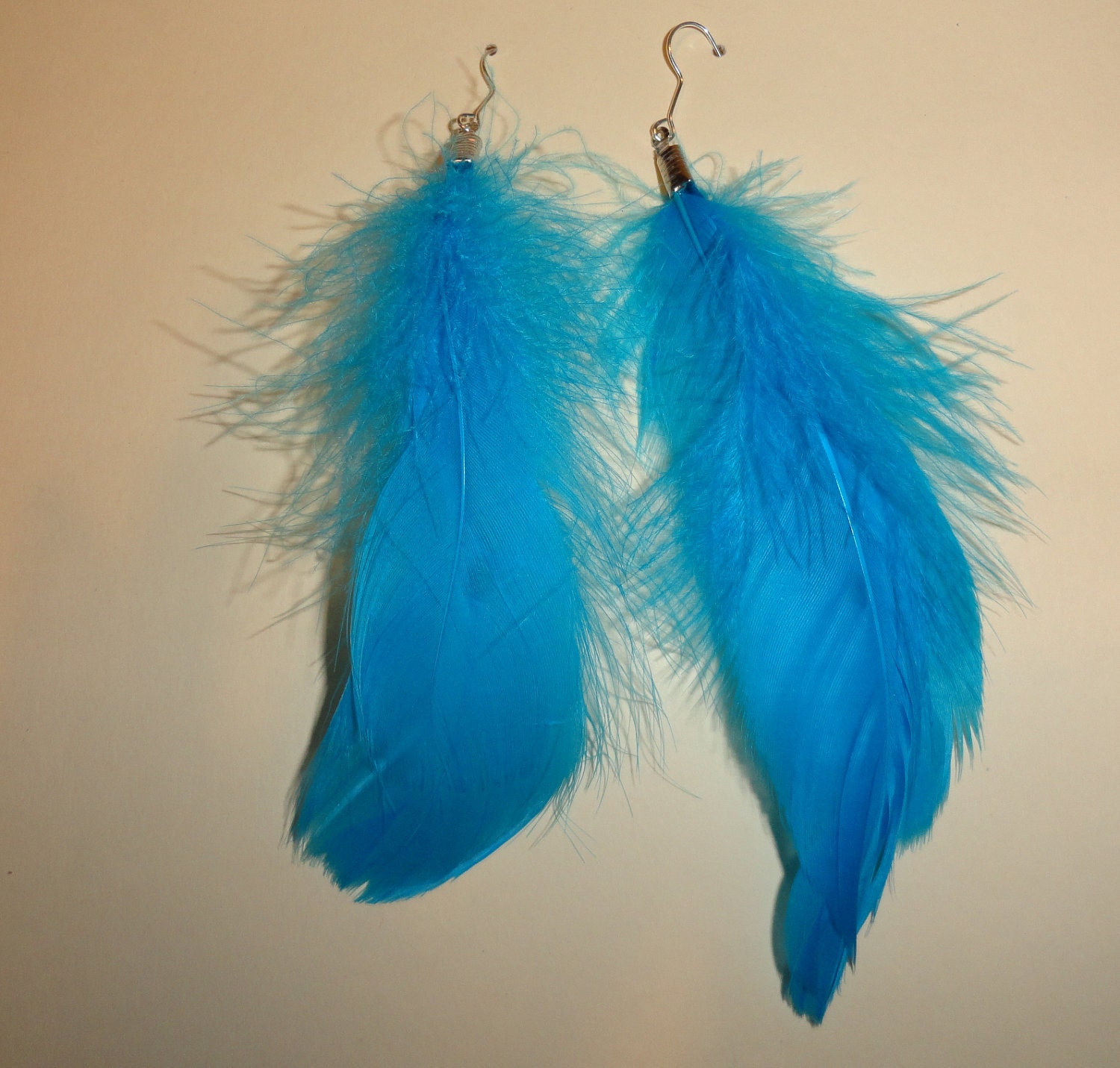 Teal blue,turquoise  feather earrings medium length