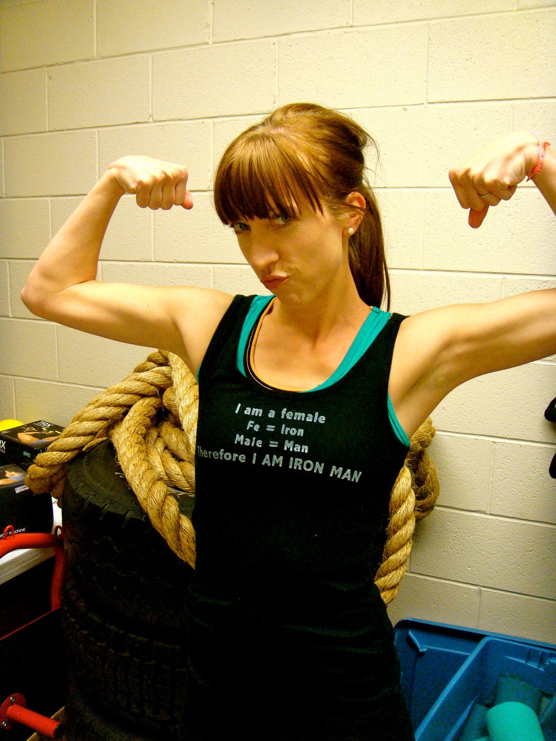 I Am Iron Man done in vintage looking silk screen on a black workout tank top with a plain back