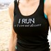 I RUN so I can eat dessert done in vintage looking silk screen on a black workout tank top with a random hole back