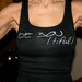 Be You(tiful) done in vintage looking silk screen on a black workout tank top with lace up back