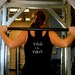 You versus You done in vintage looking silk screen on a black workout tank top with a plain front