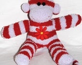 ROSIE....  a purple and red striped sock monkey