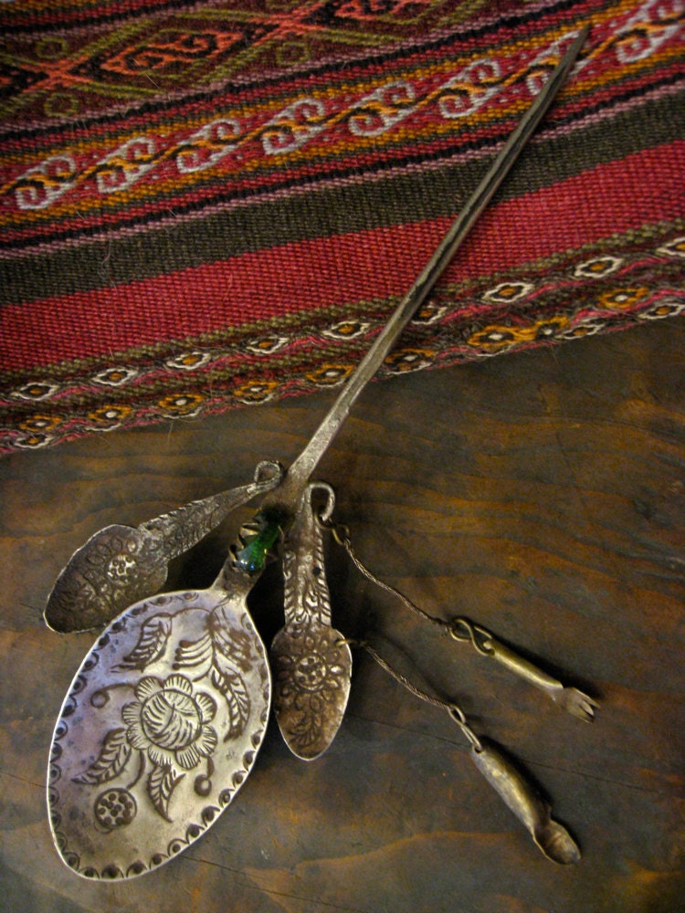 Peruvian Spoon Shawl Pin with Milagros Charms and Green Glass Bead - vintage hand-hammered silver brooch from 1920s