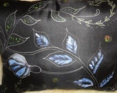 A pair of Hand painted silk pillows, black , blue, white colors. Abstract flowers. The size is 16"x20".Zipper closure.