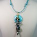 Wire Wrapped Turquoise Donut with Crystals and Key