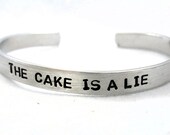 The Cake Is a Lie - Hand Stamped 1/4-inch Portal Inspired Bracelet