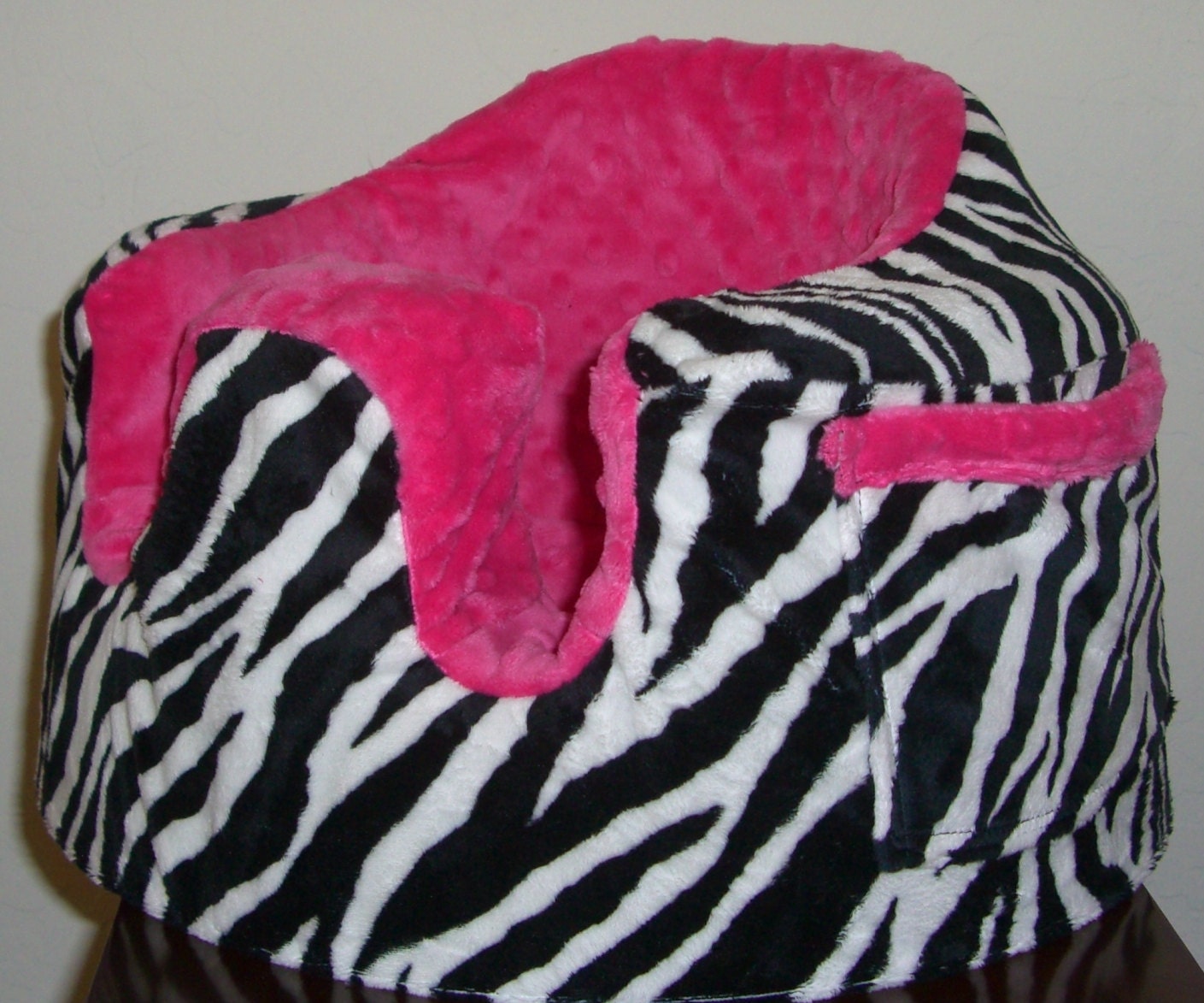 Bumbo seat slip cover, with my Original design of covered seat belt slots Zebra and hot pink minky