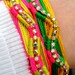 Neon, handwoven diamante friendship bracelets embellished with aurora borealis crystal chain.
