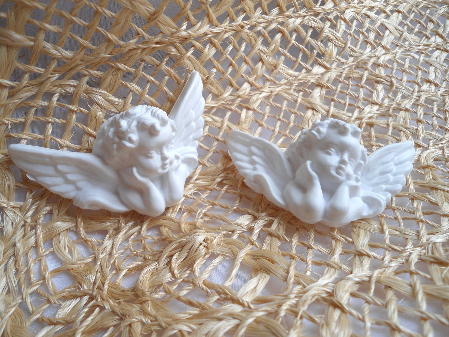 Angel heads with wings