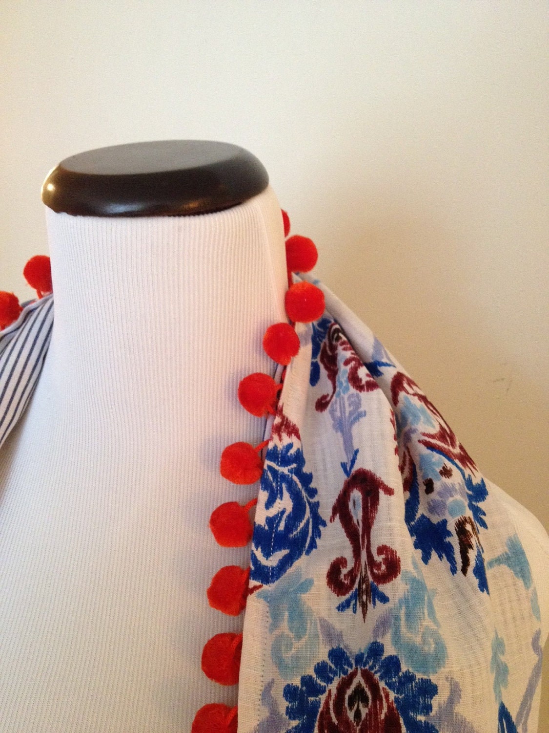 Infinity Circle Scarf with pom pom accents.