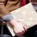Avgvst leather clutch - bone & gold polka dots