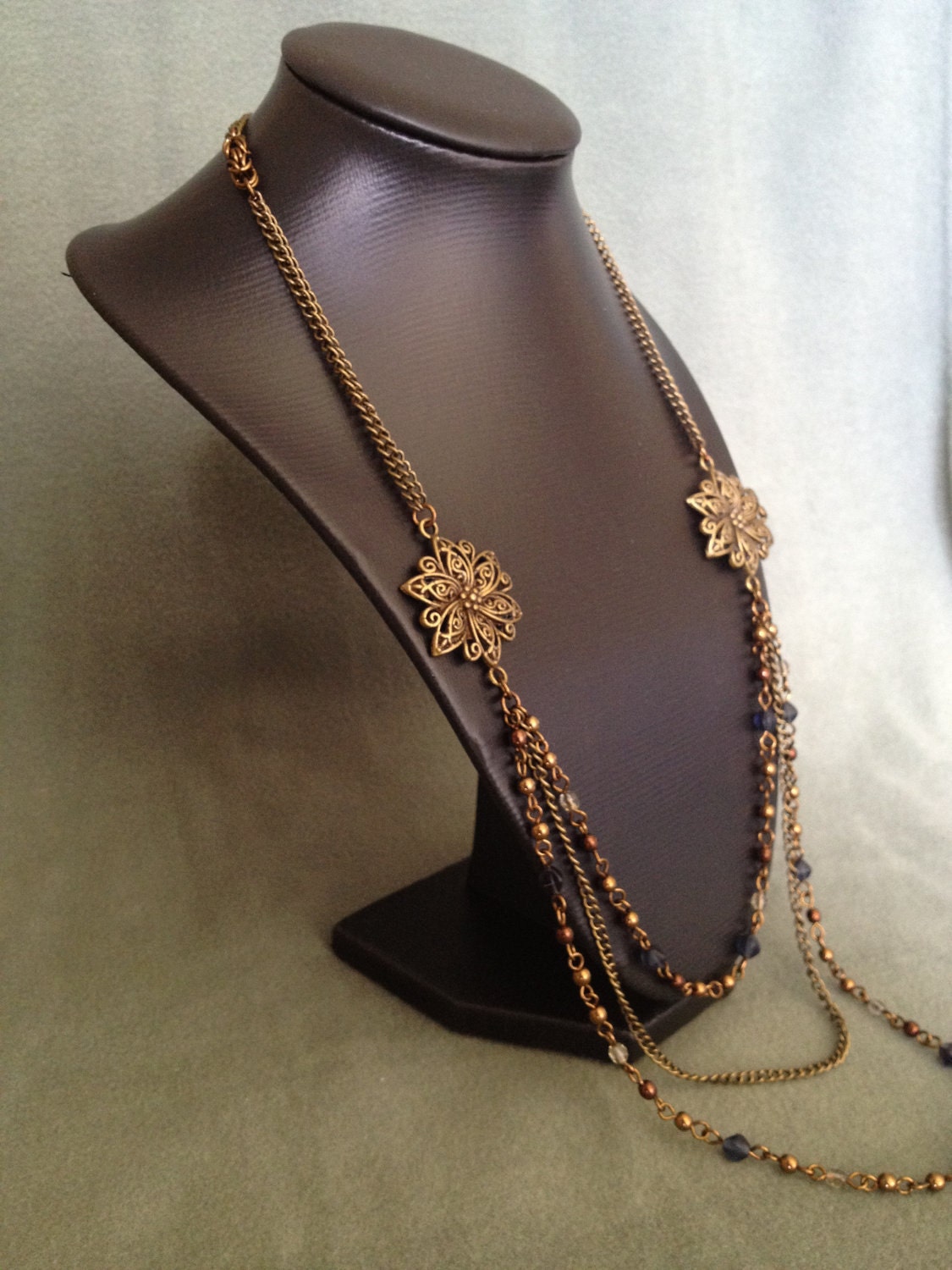 Reserved long necklace in vintage bronze with bronze , bleu and grey beads