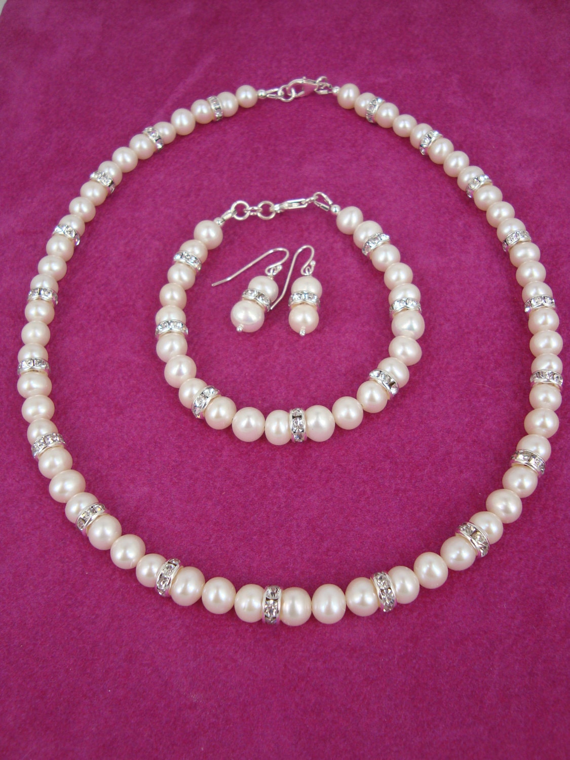 Handmade freshwater pearl and crystal rhinestone necklace, bracelet & earring set. Sterling silver findings.Wedding jewellery
