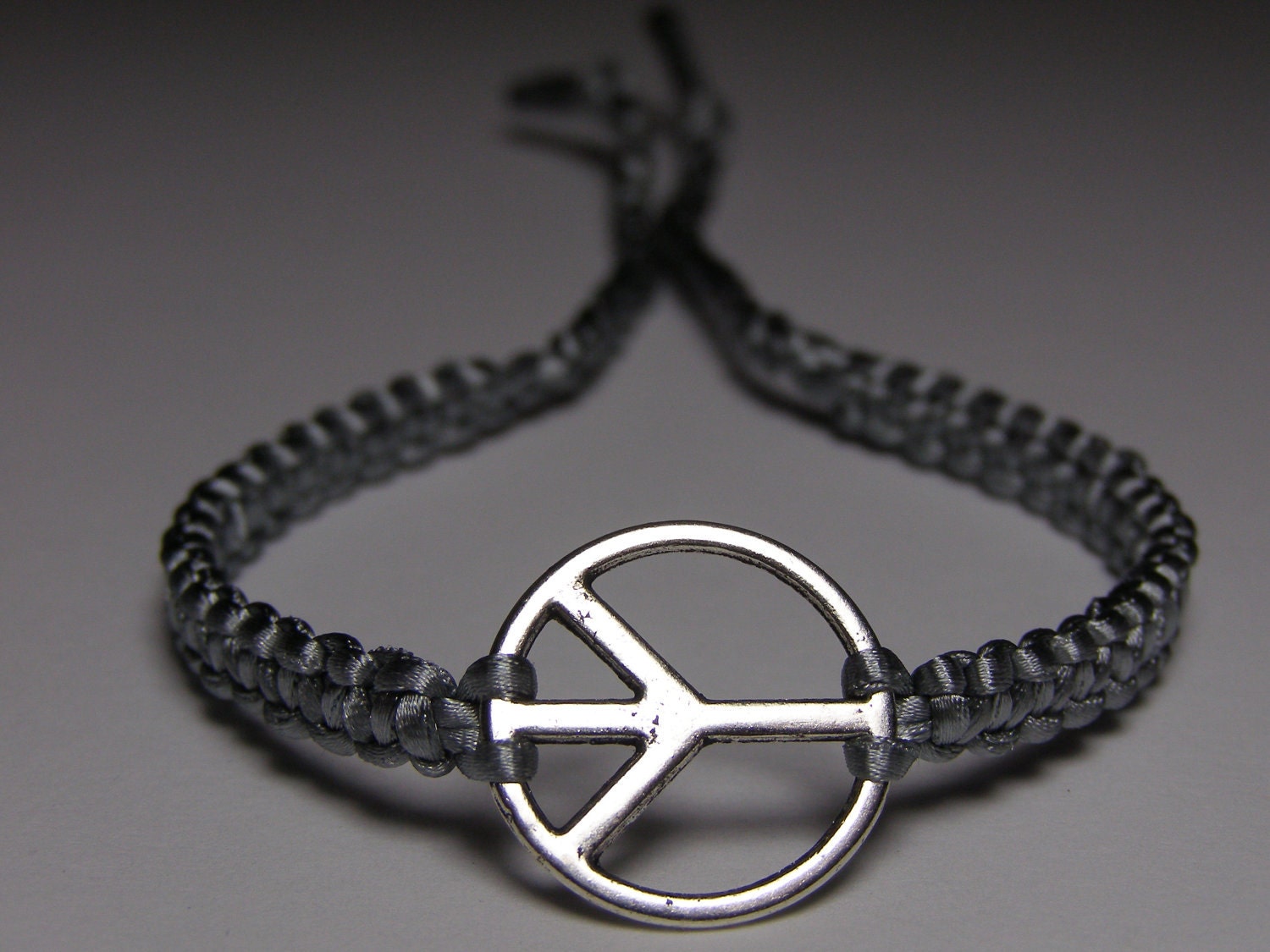 Peace Sign Bracelet with gray nylon thread