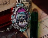 Alice in wonderland Cheshire cat cabochon covered pendant