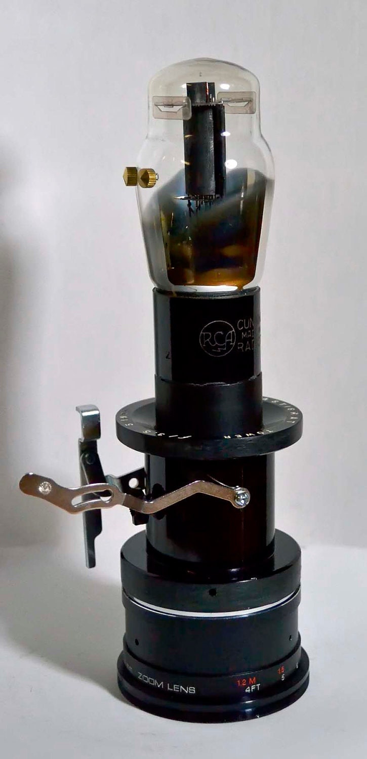 This is Just-A-Bot recycled radio tube bot using vintage and antique treasures robot  signed by artist