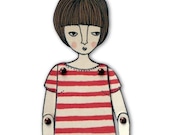 miniature moveable paper doll (in red stripes)
