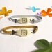 Golden and Silver Fake watch with elastic watchband bracelet. One-of-a-kind handmade Porcelain toy clock.