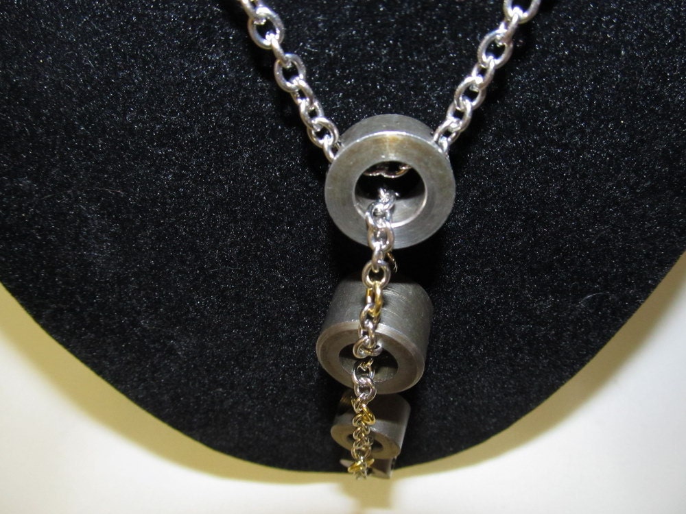 Necklace:  Unique gears Steampunk Pfaff 130 Sewing Machine part necklace. 4 steel tires