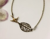 An Antiqued Brass Leaf. Single Ivory Pearl, Flying Swallow Bird Necklace. Bridesmaid Gifts. Maid Of Honor. Bridesmaid Necklaces. For Sis.