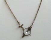 Asymmetrical Hunger Games Girl on Fire Katniss Bow and Arrow Mockingjay Necklace with Peetas Pearl