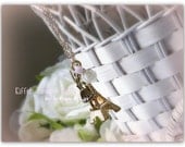 Eiffel Tower Dance necklace made with gold Eiffel Tower charm, antiqued brass ballerina, white rose, swarovski crystal etc.