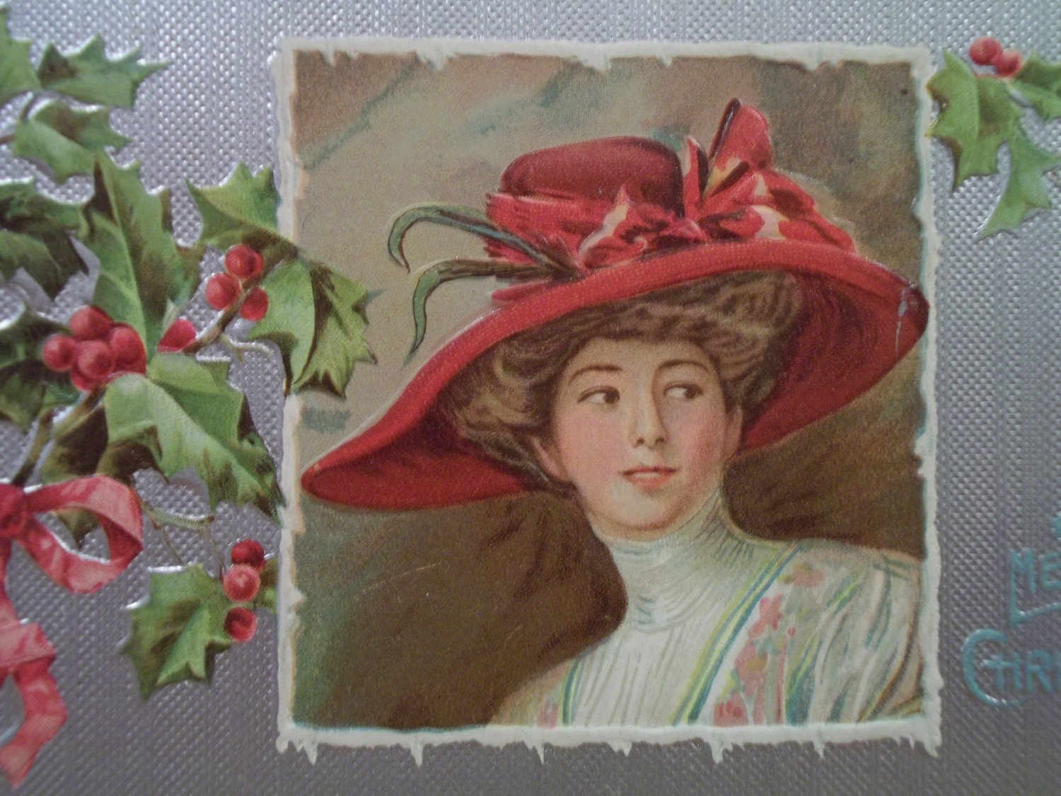 Beautiful Lady with Large Red Hat - Embossed Christmas Postcard - early 1900's