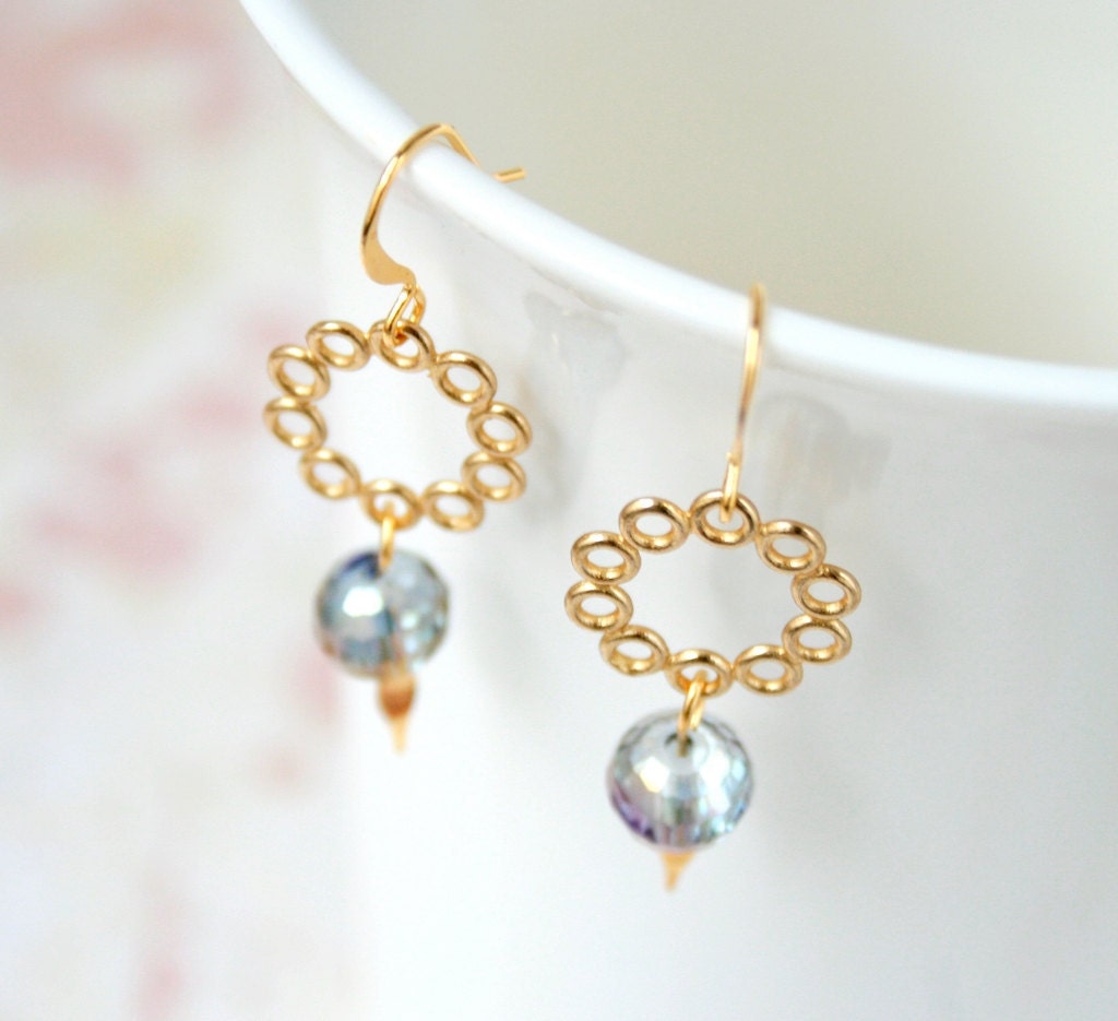 Cosmic ring gold earrings with polished lacy rings and chameleon faceted transparent glass, very airy and shimmering design
