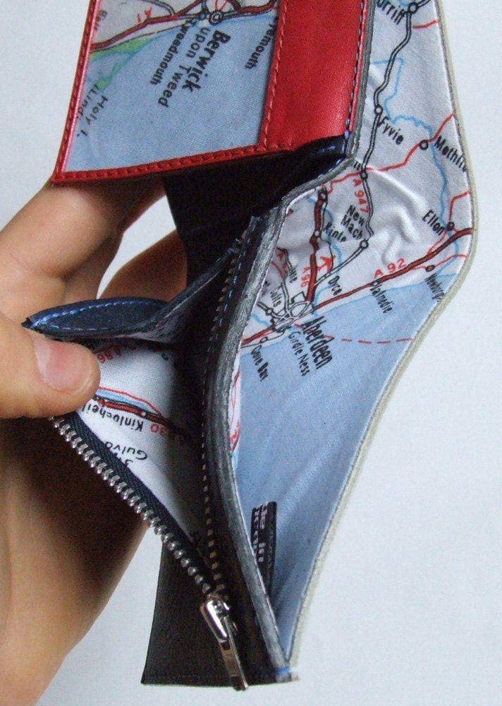 White leather wallet with map lining and navy/red inside