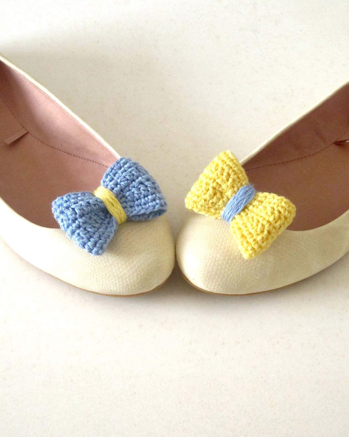 Opposites attract. Crochet bow shoe clips.Sky blue and pale yellow.
