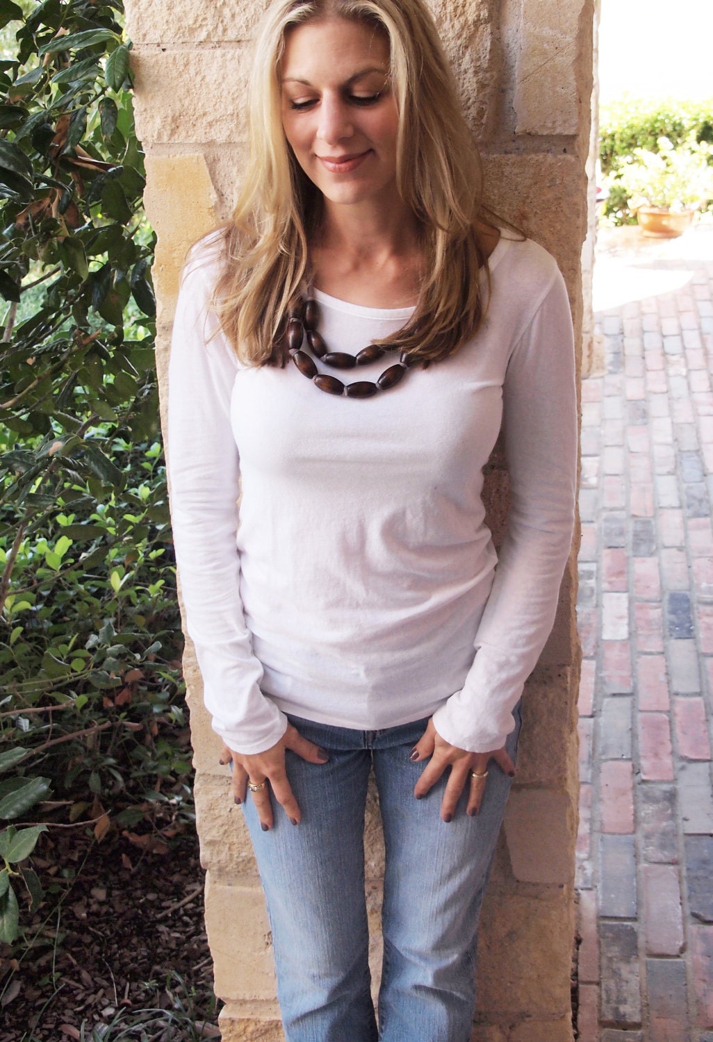 brown wooden bib necklace with gray jersey tie