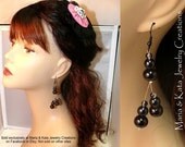 A beautiful modern classic dangle earrings in groups of threes glass beads