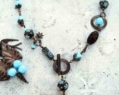 Ceramic pendant, stone ware, blue daisy, antiqued brass,Czech fire polished beads necklace by Esfera Jewelry