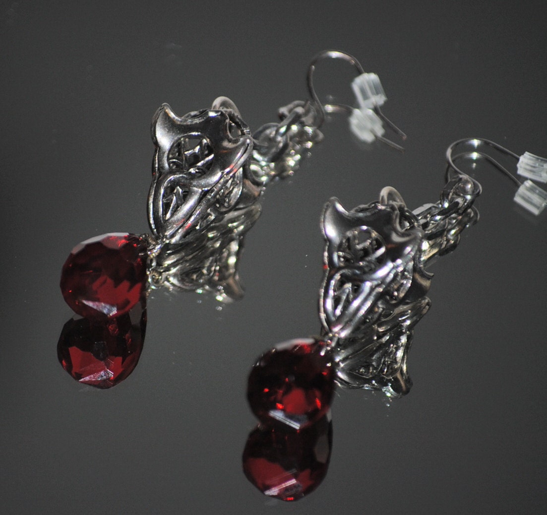 Upcycled Art Deco meets Steampunk .. Antique Deco Red Crystals, Married to Vtg Steel Ravens Claw earrings