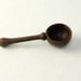 Small Wooden Spoon in Walnut,  Approx. 1" wide and 2.25" long.