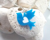 Ruben the Dove necklace with replaceable coloured hearts