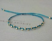 tiny faceted gold nuggets beaded adjustable friendship bracelet. riley.