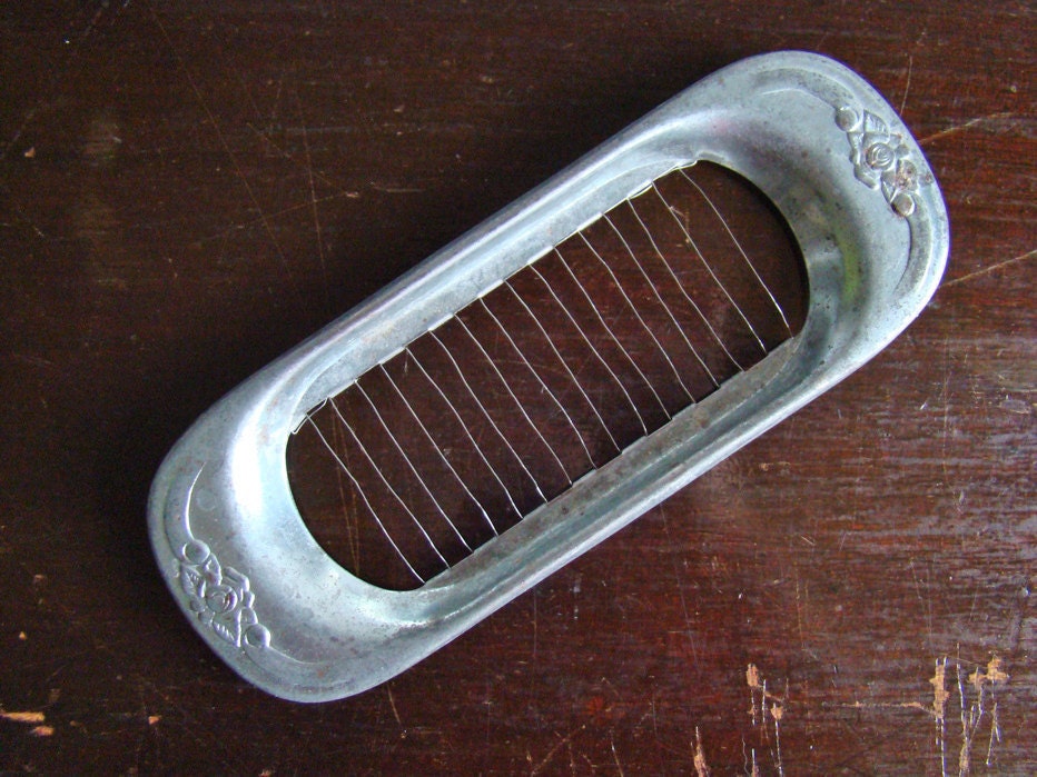 vintage aluminum butter pat slicer with floral motif