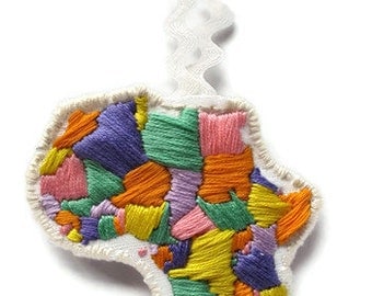 Africa embroidered ornament in pastels for Kwanzaa or Christmas