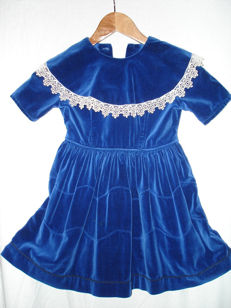 Girl's blue velvet dress with lace trim