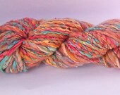 Sunken treasure. Hand spun art yarn.  Hand painted silk & Australian merino.  Sandy pink with jewel coloured silk.